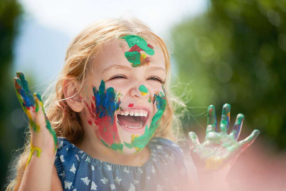 Pretty Blonde Girl Painting Face